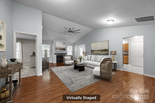 68 Wiltshire Cir, Fletcher, NC 28732 - living room with wood finished floors, ceiling fan, high vaulted ceiling, a fireplace, and baseboards
