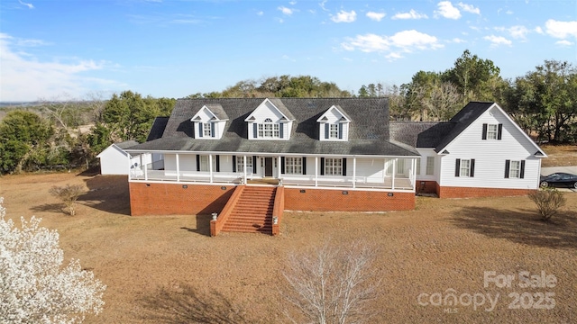 view of front of house featuring stairs and a porch