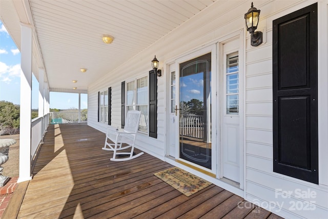 wooden deck featuring covered porch