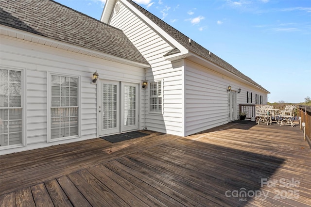 deck with outdoor dining area