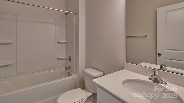 full bathroom featuring bathtub / shower combination, vanity, and toilet