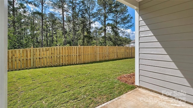 view of yard with a fenced backyard