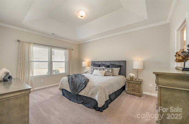 bedroom featuring a raised ceiling, crown molding, light colored carpet, and baseboards