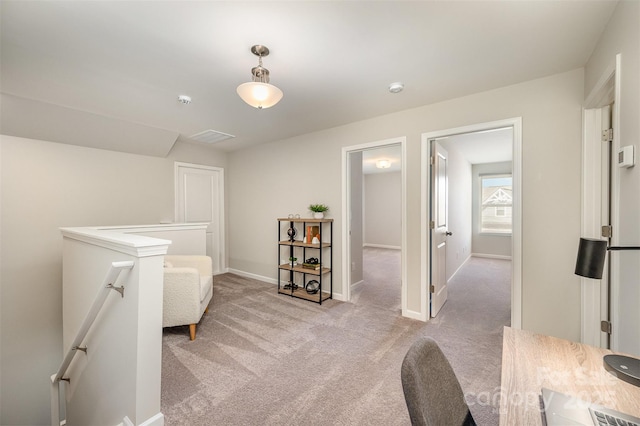 interior space with baseboards and light carpet