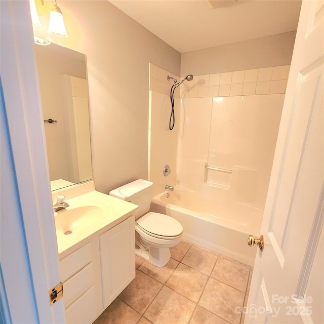 bathroom featuring tile patterned flooring, toilet, vanity, and shower / washtub combination