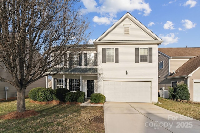 traditional-style home with driveway, a balcony, an attached garage, and a front lawn