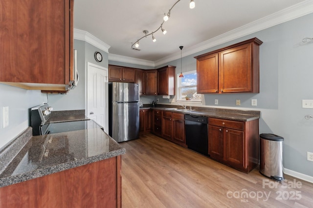 kitchen with stainless steel appliances, ornamental molding, light wood-type flooring, and a sink