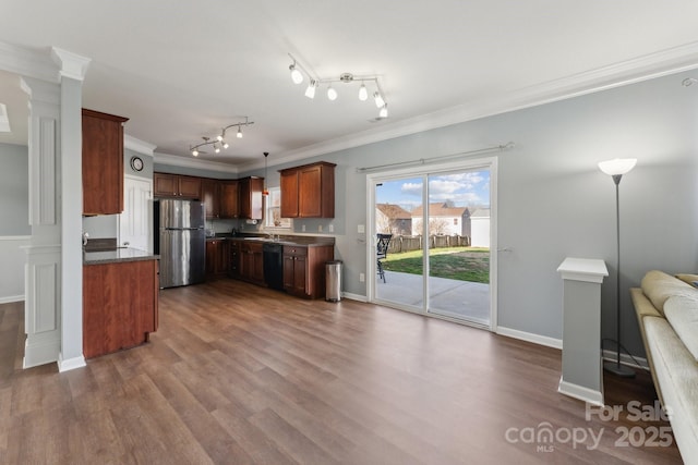 kitchen featuring black dishwasher, dark wood finished floors, crown molding, freestanding refrigerator, and open floor plan