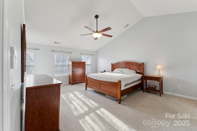 bedroom featuring baseboards, visible vents, vaulted ceiling, and light colored carpet