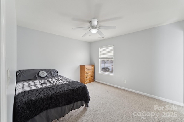 carpeted bedroom with a ceiling fan, visible vents, and baseboards