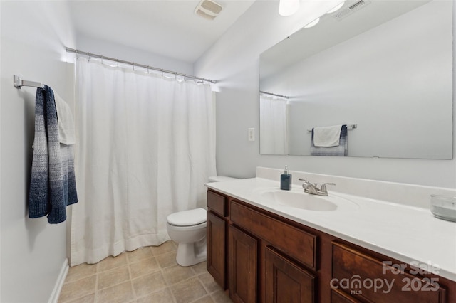 bathroom featuring visible vents, vanity, and toilet