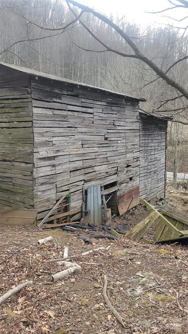 view of home's exterior featuring an outdoor structure