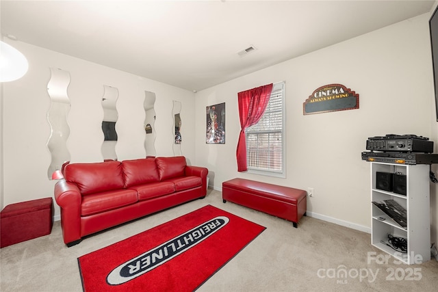 carpeted living room with visible vents and baseboards