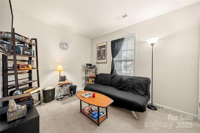 carpeted living room featuring baseboards and visible vents