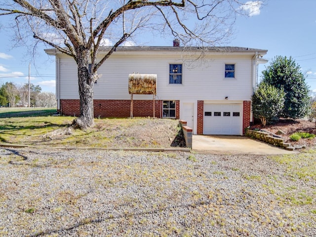view of front of home with driveway and an attached garage