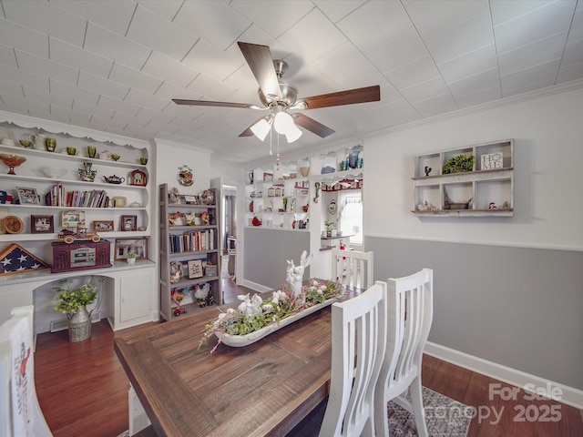 dining space featuring ceiling fan, wood finished floors, and ornamental molding