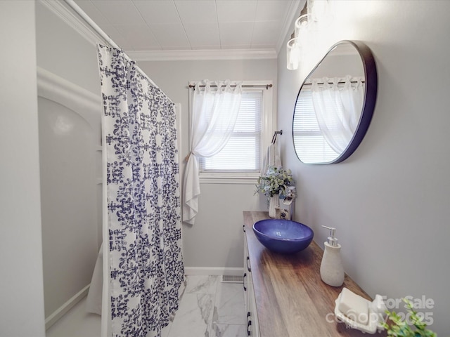 bathroom with vanity, a shower with curtain, baseboards, crown molding, and marble finish floor
