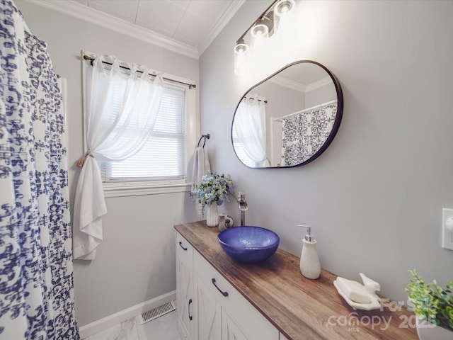 bathroom with visible vents, marble finish floor, crown molding, baseboards, and vanity