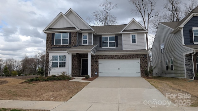 view of front of house with an attached garage, brick siding, a shingled roof, driveway, and board and batten siding