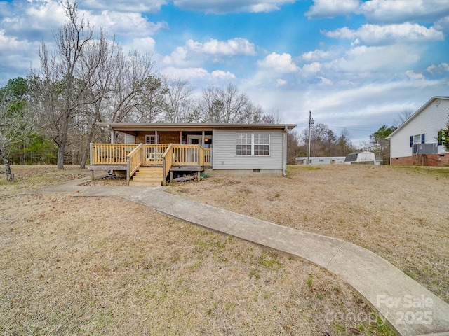 view of front of house featuring a deck and crawl space