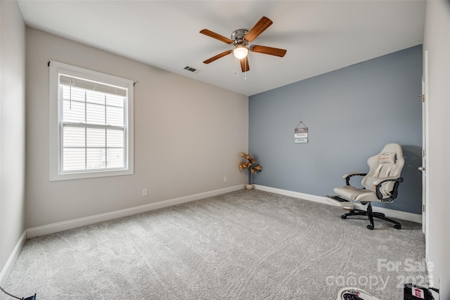 unfurnished room with a ceiling fan, carpet flooring, baseboards, and visible vents