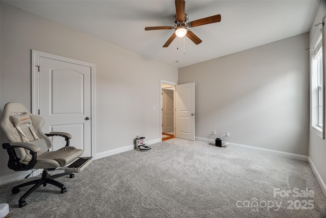 sitting room with carpet flooring, a ceiling fan, and baseboards