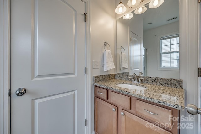 bathroom featuring visible vents and vanity