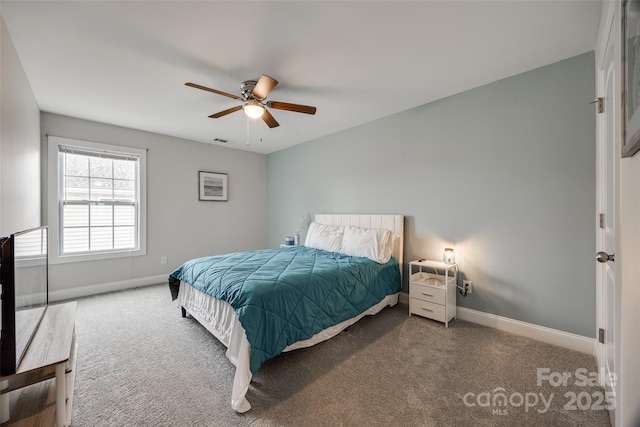 carpeted bedroom with a ceiling fan, visible vents, and baseboards