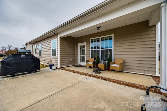 view of patio / terrace featuring covered porch and a grill