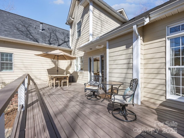 wooden deck with outdoor dining area