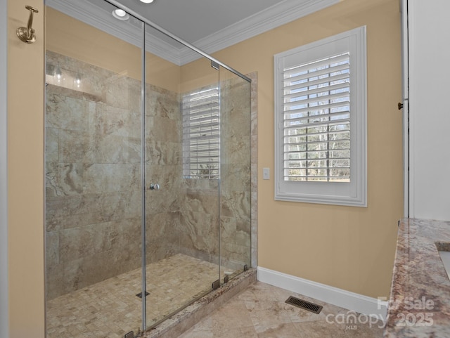 full bathroom with a stall shower, baseboards, visible vents, and ornamental molding