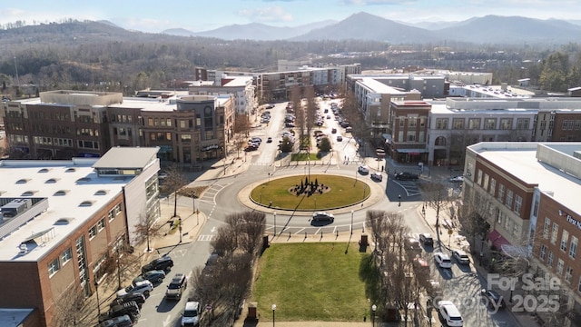 property's view of city with a mountain view