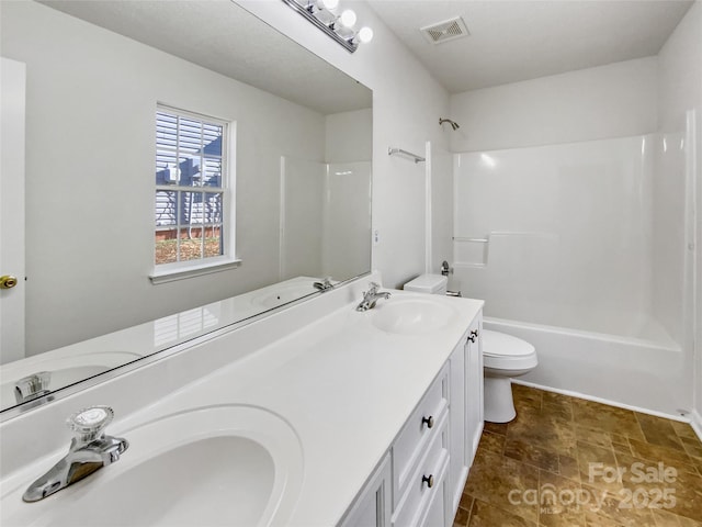 bathroom with shower / tub combination, visible vents, a sink, and toilet