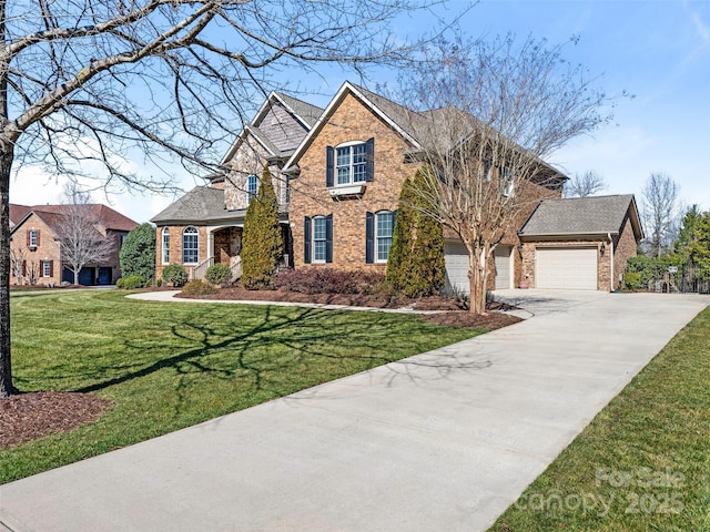 view of front of property with a front yard, concrete driveway, and brick siding