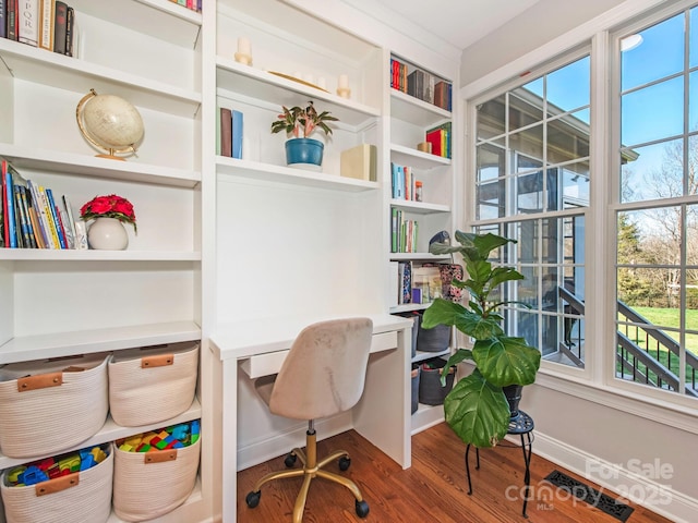 office featuring baseboards and wood finished floors