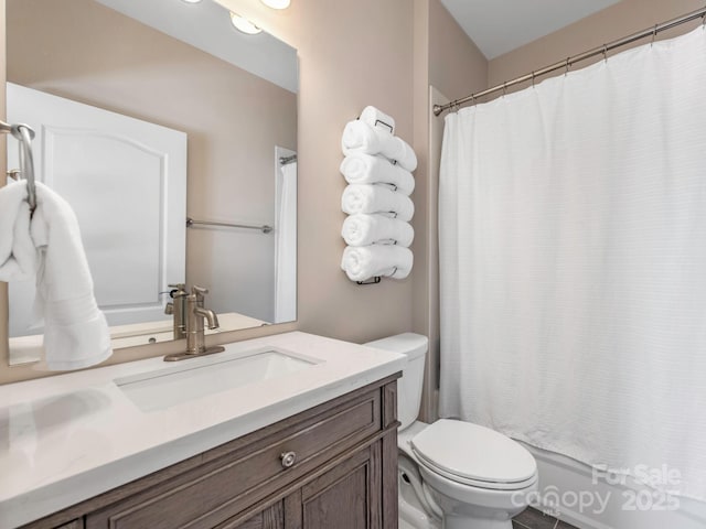 full bath featuring toilet and vanity