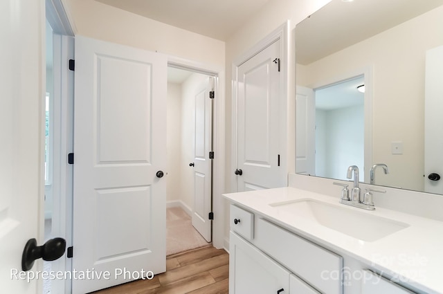 bathroom featuring vanity and wood finished floors