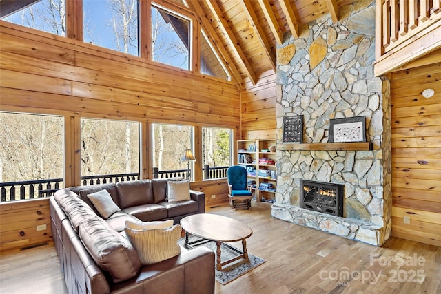 200 Blue Gill Dr, Lake Lure, NC 28746 - living room with wood walls, beam ceiling, wooden ceiling, a fireplace, and wood finished floors