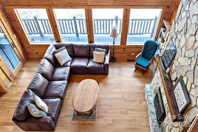 200 Blue Gill Dr, Lake Lure, NC 28746 - living room featuring a stone fireplace, visible vents, wooden walls, and wood finished floors