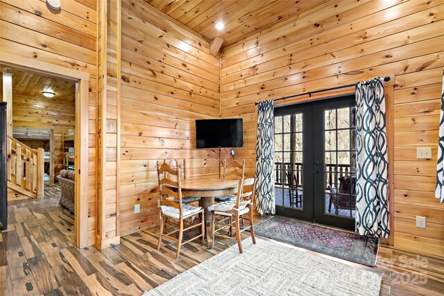 200 Blue Gill Dr, Lake Lure, NC 28746 - dining space featuring french doors, wood walls, and wooden ceiling