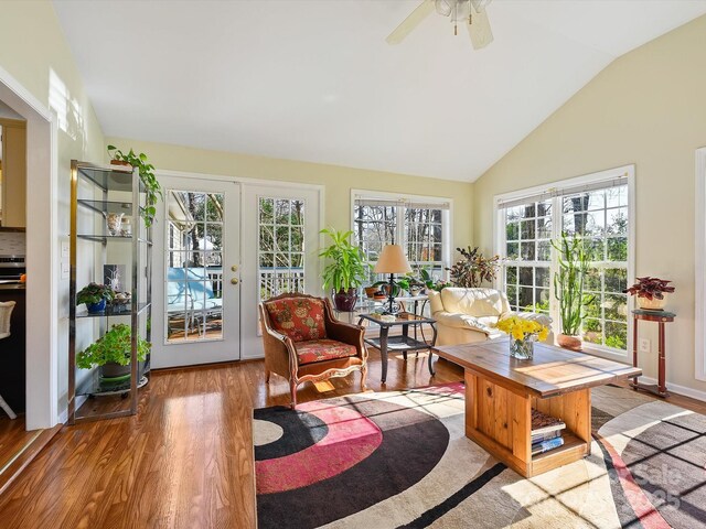 sunroom featuring ceiling fan and vaulted ceiling