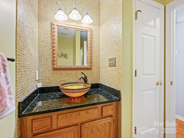 bathroom with backsplash and vanity