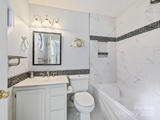 full bath with toilet, a textured ceiling, tile walls, bathtub / shower combination, and vanity