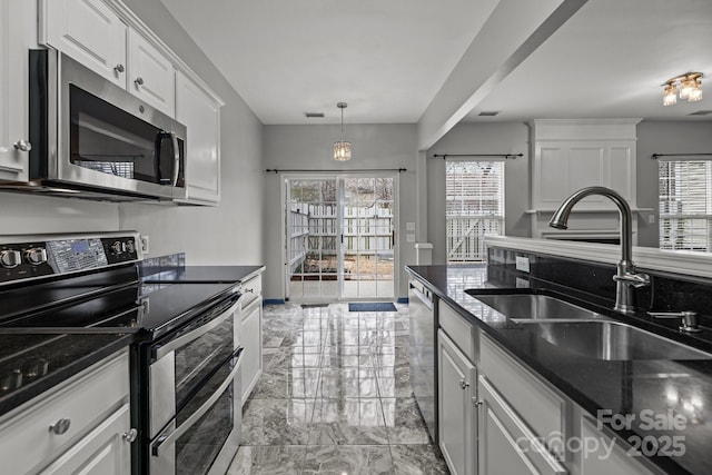 11712 Huxley Rd, Charlotte, NC 28277 - kitchen featuring visible vents, stainless steel appliances, marble finish floor, white cabinetry, and a sink