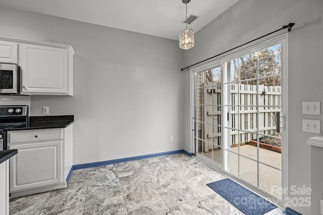 11712 Huxley Rd, Charlotte, NC 28277 - unfurnished dining area with a notable chandelier, visible vents, and baseboards