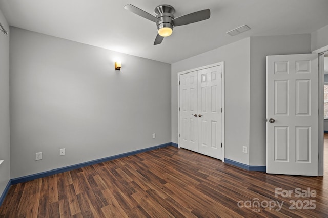 11712 Huxley Rd, Charlotte, NC 28277 - unfurnished bedroom featuring dark wood finished floors, visible vents, a closet, and baseboards
