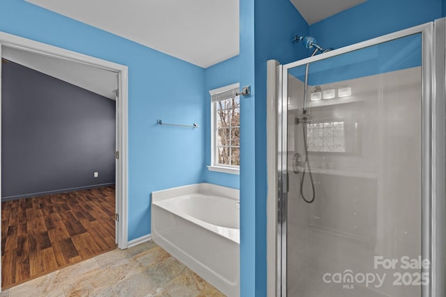 11712 Huxley Rd, Charlotte, NC 28277 - full bathroom featuring a shower stall, a bath, and baseboards