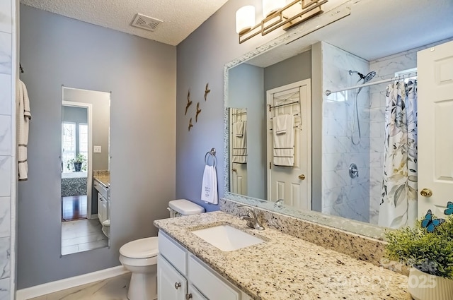 bathroom with a textured ceiling, toilet, visible vents, and tiled shower