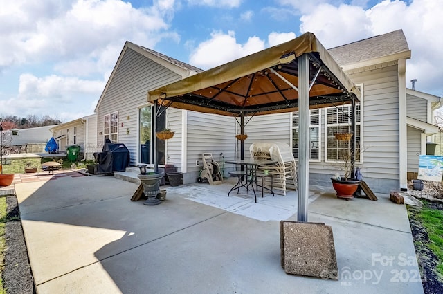 view of patio / terrace featuring a gazebo and a grill