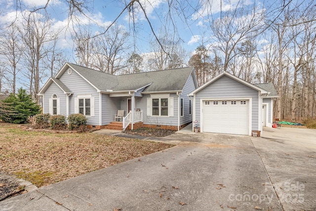 ranch-style house featuring a shingled roof, crawl space, driveway, and an attached garage